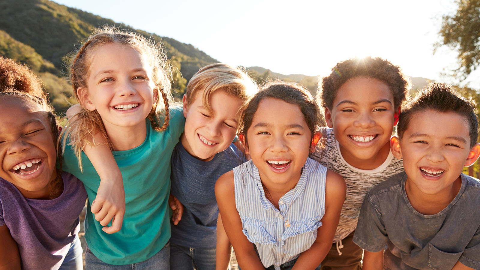 Children looking down at camera